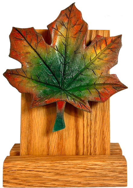 Carved Maple Leaf painted in the Canadian fall colours